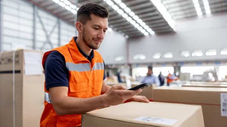 employee scanning barcode on package